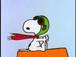 The Flying Ace on his doghouse, scarf blowing, on patrol.